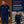 Sparco Martini Racing Crewneck Sweater hero image with two models, indoor and outdoor lifestyle views, showing logos and tri-stripe sleeve detail

